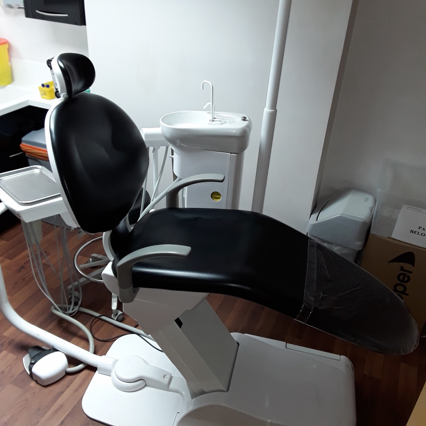 A treatment room inside East Ham Dental Care, with the dental chair, sink and equipment ready for a patient